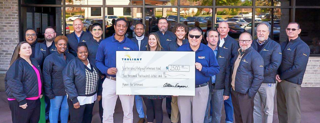 Truliant presenting check to local charity