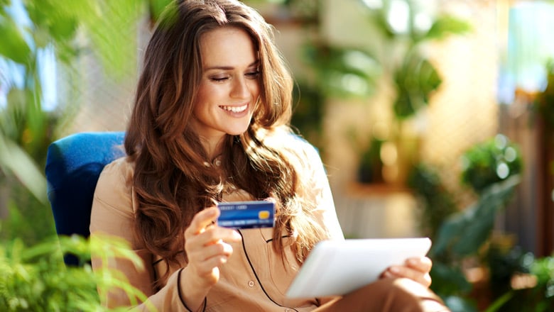 Woman with a credit card and pad