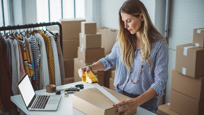 Business owner getting packages ready to ship out