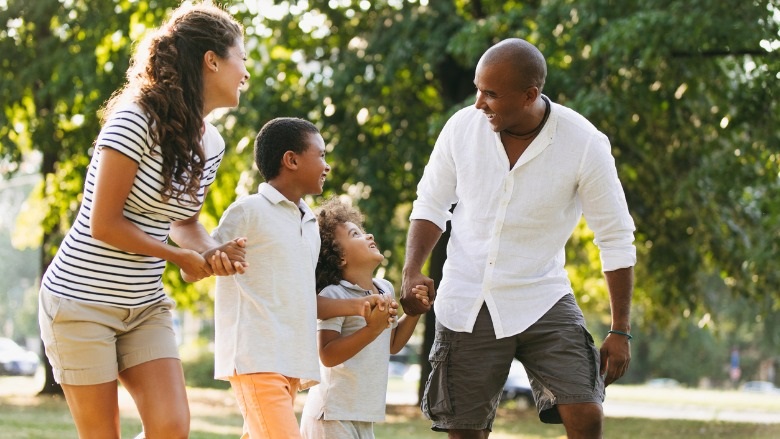 mom and dad with kids in park