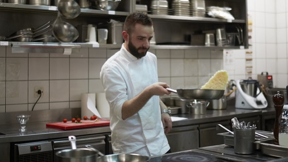 Man cooking in a restaurant kitchen