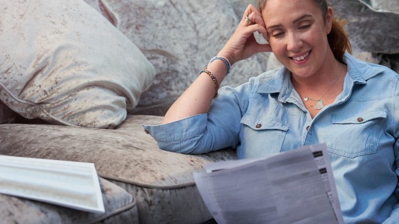 Woman reading bank statements