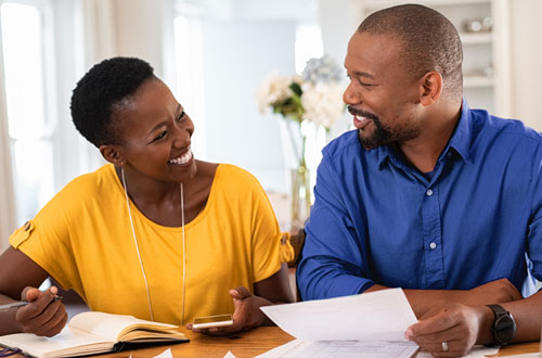 Couple smiling at table