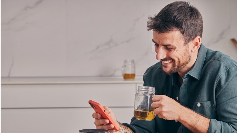 Handsome man looking at the smartphone