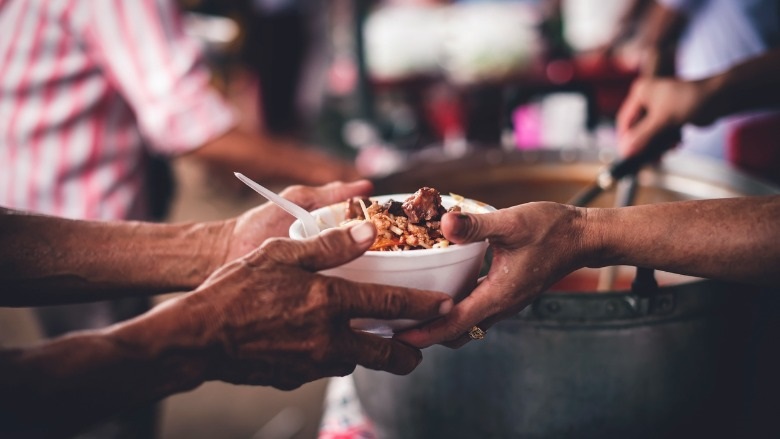 Volunteers serving a meal